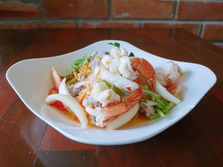 Yummy Vermicelli spicy seafood salad. Thai vermicelli and seafood salad (Yum Woon Sen)