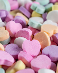 Assortment of candy hearts.  Blurry background.