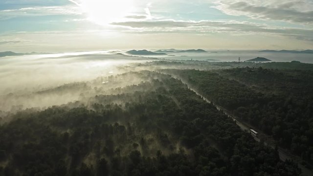 Beautiful view of a misty scenery at sunrise. Zadar Croatia. Aerial view travelling backwards