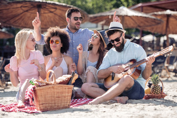 Friends having fun on the beach