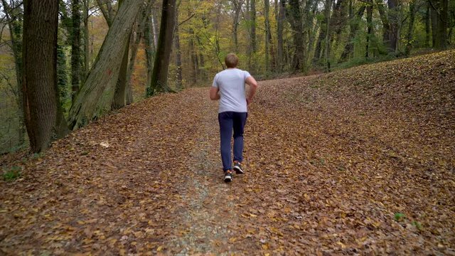 Image of your man running on public park, Zagreb, Croatia.
