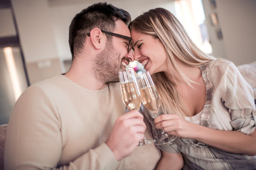 Couple drink wine at home