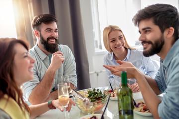 Friends having lunch together at home