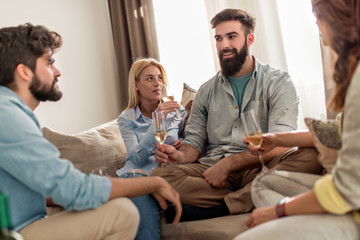 Friends toasting in living room