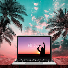 Blog social media information connect concept on laptop with sunset background.
