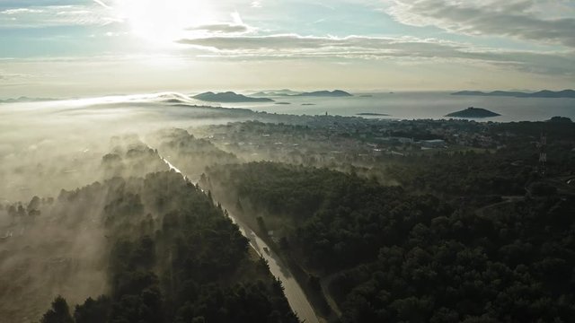 Beautiful view of a misty scenery at sunrise in the outskirts of Pakostane. Zadar Croatia. Aerial view travelling backwards