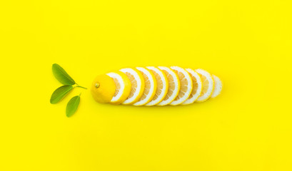 Top view of lemon and leaves on yellow color background.concepts ideas of fruit