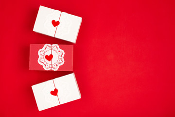 Three gift boxes on red background