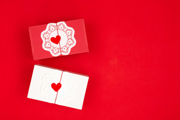 Two gift boxes on red background