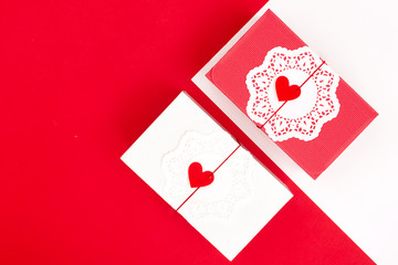 Two gift boxes on red background