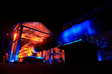 idle cement plant rotary kiln machinery at night