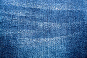 Shabby denim texture for background. Blue jeans