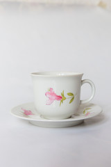 a white tea set with pattern on white background