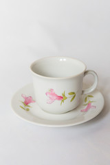 a white tea set with pattern on white background