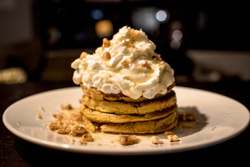 pancakes with whipped cream and nuts