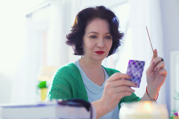 Smart skilled fortune teller reading the card