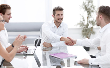 business people shaking hands during business negotiations