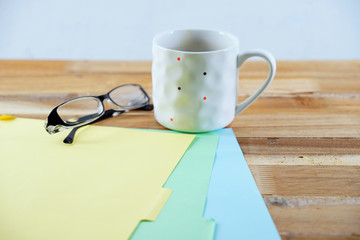 Office desk with mug in selective focus 