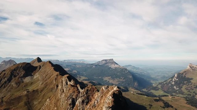 Drone flying along alpine summits in summer in Switzerland 4k