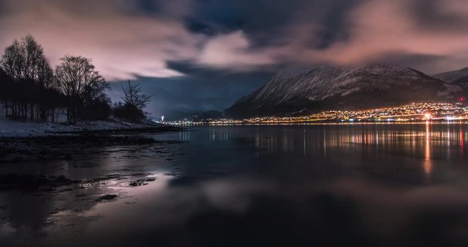 Motion timelapse of &Oslash;rsta with fast clouds and iced salt water. Long exposure photos. In Sunnm&oslash;re in M&oslash;re og Romsdal