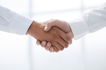 close up.handshake of business people on a light background