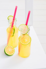 Cool fresh lemonade with lime in bottles