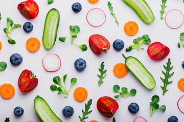 Fresh green salad sprouts, blueberries,  and vegetables pattern