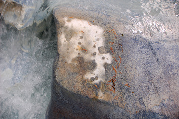 Wet stones make interesting pattern on rock in South mineral creek river bed along the Rico Silverton trail in the San Juan range of the Colorado Rockies.