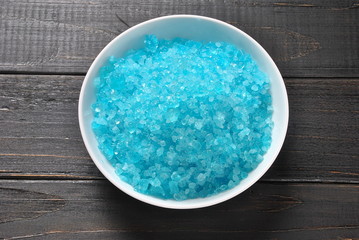 Spa and body care products. Colorful aromatic bath Dead Sea salt. Natural ingredients for homemade body salt scrub. Dead Sea cosmetics. Beauty skin care. Spa treatment.