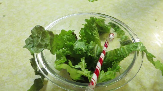 Candy Cane Salad Falling into a Clear Bowl