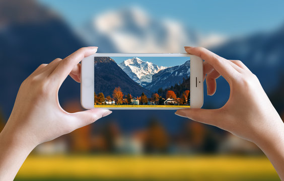 hands take photo of nice mountain and sky scenery view with mobile smartphone