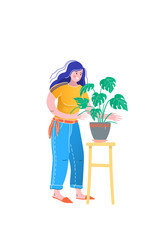 Care of house plants. The girl in an environment of house plants in pots and wicker baskets