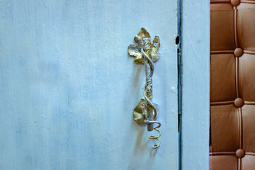 carved door handle made of iron with golden paint