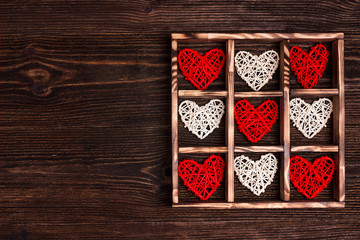 Valentine's day background with hearts in the box on wooden table. Copy space for text.