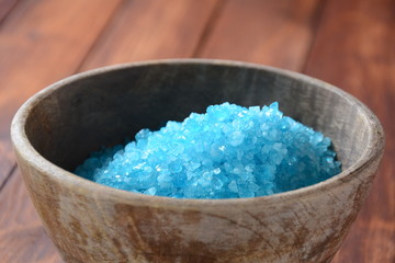 Sea shell on the colorful salt background. Spa and body care concept. Dead Sea Salt. Aromatic spa treatment. Natural ingredients for homemade body salt scrub. Beauty and skin care concept.