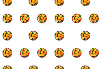 Fototapeta na wymiar Red plate of oranges and tangerines with green leaves on a light background Top view copy space pattern