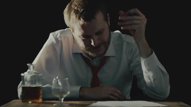 tired businessman does not dare to sign documents or important papers, bankruptcy concept