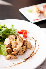 Grilled chicken with green salad and balsamic dressing