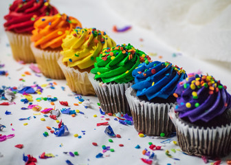 colorful cupcakes with frosting and sprinkles
