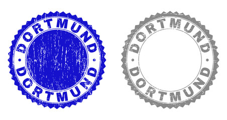 Grunge DORTMUND stamp seals isolated on a white background. Rosette seals with distress texture in blue and grey colors. Vector rubber stamp imitation of DORTMUND text inside round rosette.