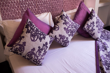 Interior design of a hotel bedroom in a traditional moroccan style. Beautiful deluxe room interior view decorated with arabian motifs.