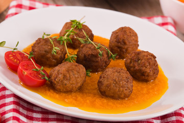 Meatballs with mashed carrots. 
