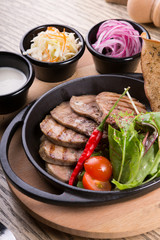 Fired beef tongue served with chili pepper