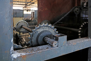 Fototapeta na wymiar Transmission gear of steel spade production line