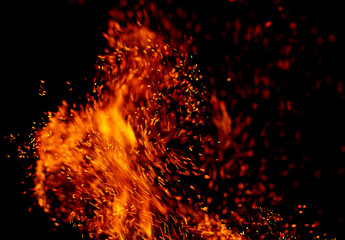 Fototapeta na wymiar flame of fire with sparks black background
