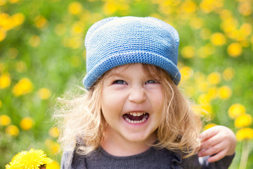 Portrait of cute happy little gir with dandelion, © rimmdream