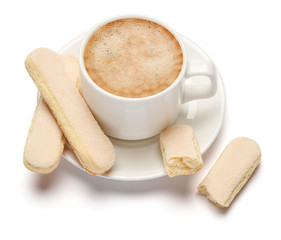 White ceramic cup of coffee with a savoiardi ladyfinger cookie on a plate