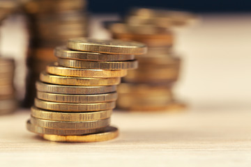 piles of coins on working table
