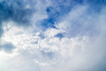 Blue and white cloudy skies background