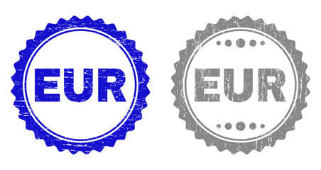 Grunge EUR stamp seals isolated on a white background. Rosette seals with grunge texture in blue and grey colors. Vector rubber stamp imitation of EUR label inside round rosette.